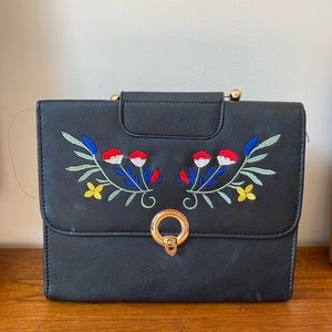 Floral black leather handbag